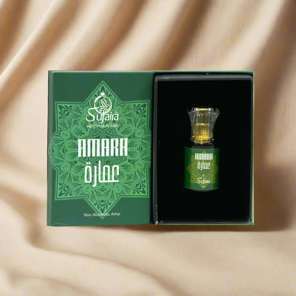 Sujaira Amara Ojlaa perfume bottle with green packaging on a gray background