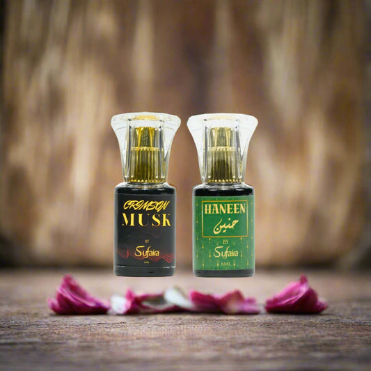 Two bottles of perfume, one labeled 'Crimson Musk' and the other 'Haneen', 