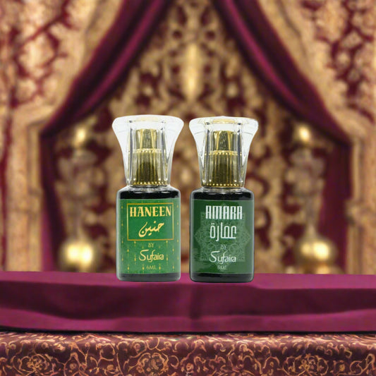 Two green bottles with gold caps labeled 'Haneen' and 'Amara' 