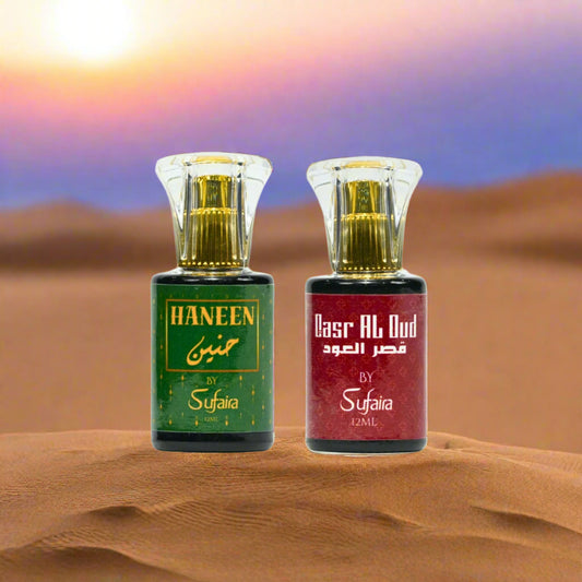 Two perfume bottles labeled 'Haneen' and 'Qasr Al Oud' by Sufaira 