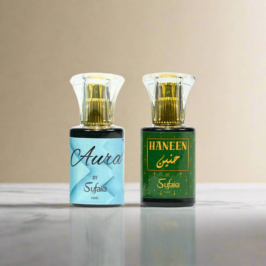 Two perfume bottles labeled 'Aura by Sufaira' and 'Haneen by Sufaira'