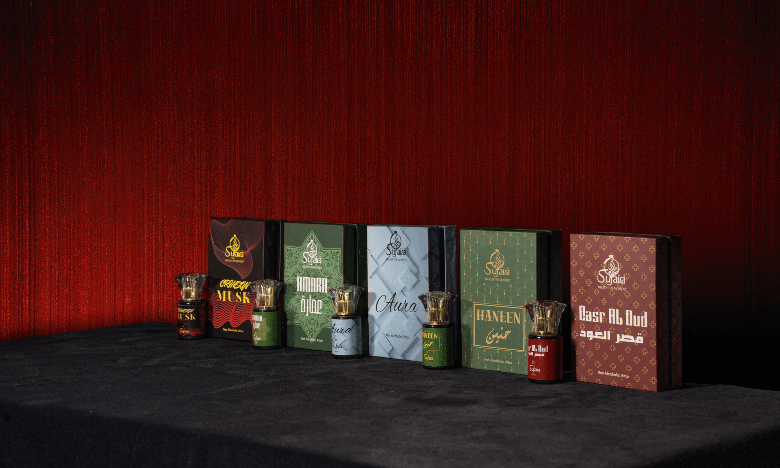 All five Sufaira Rehl attar bottles with their presentation boxes